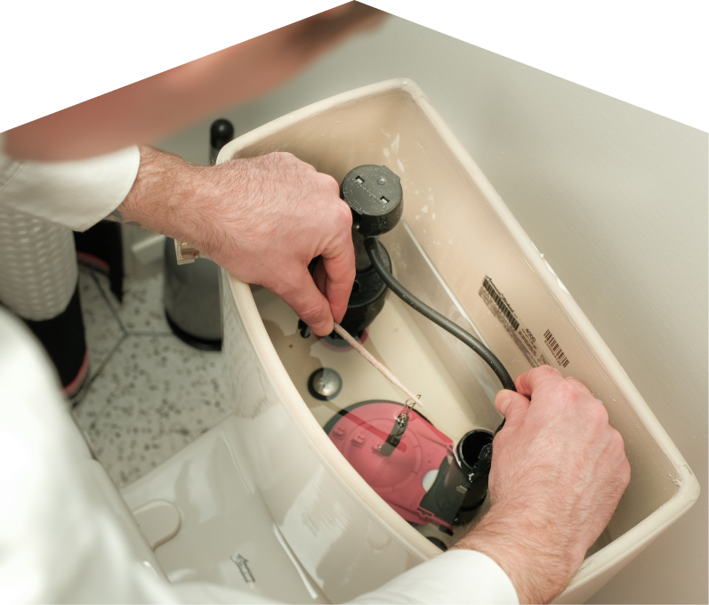 M&K plumbing specialist adjusts internal components of a toilet tank, with tile flooring visible in the background. M&K plumbing specialist adjusts internal components of a toilet tank, with tile flooring visible in the background.