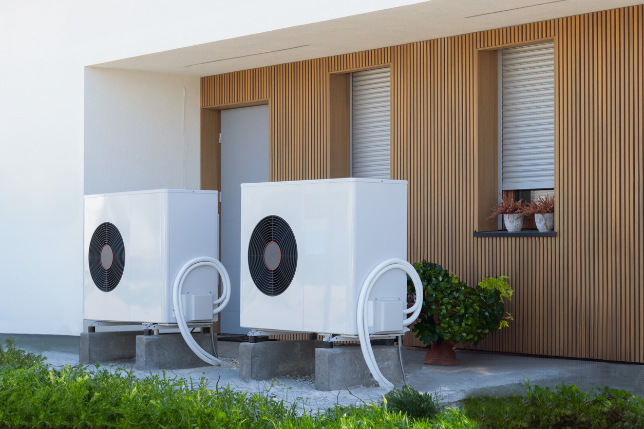 Eco-Friendly White Air Source Heat Pump at Modern Home Exterior Eco-Friendly White Air Source Heat Pump at Modern Home Exterior