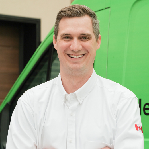 M&K technician standing by our famous green trucks in a residential neighbourhood. M&K technician standing by our famous green trucks in a residential neighbourhood.