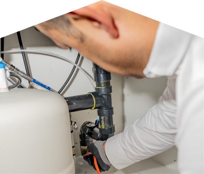 An M&K plumbing specialist uses a hydro jet to clear a clogged drain. An M&K plumbing specialist uses a hydro jet to clear a clogged drain.